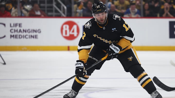 Mar 11, 2025; Pittsburgh, Pennsylvania, USA;  Pittsburgh Penguins right wing Bryan Rust (17) skates with the puck against the Vegas Golden Knights during the third period at PPG Paints Arena. Mandatory Credit: Charles LeClaire-Imagn Images