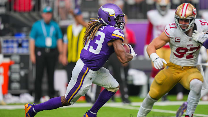 Sep 15, 2024; Minneapolis, Minnesota, USA; Minnesota Vikings running back Aaron Jones (33) runs with the ball against the San Francisco 49ers in the third quarter at U.S. Bank Stadium.
