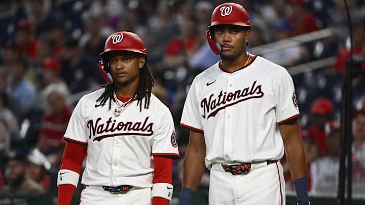 Jun 18, 2025; Washington, District of Columbia, USA; Washington Nationals shortstop CJ Abrams (left) and left fielder James Wood talk during the first inning against the Colorado Rockies at Nationals Park.