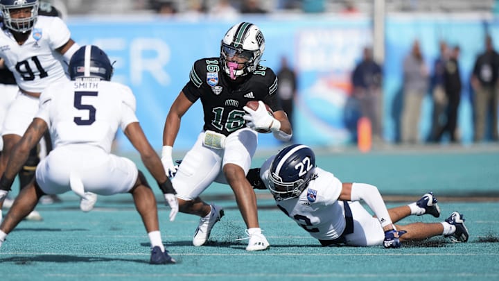 Chase Hendricks (16) tries to elude defenders last season while playing for Ohio U