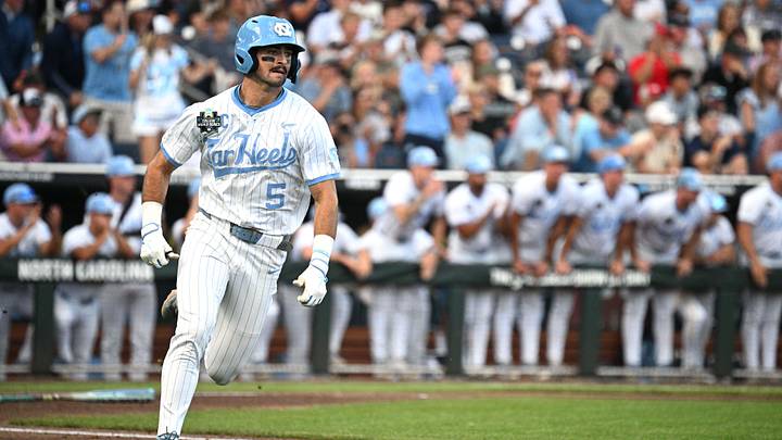 Jun 22, 2026; Omaha, NE, USA;  North Carolina Tar Heels second baseman Gavin Gallaher (5) singles in a run against the Oklahoma Sooners during the third inning at Charles Schwab Field. Mandatory Credit: Steven Branscombe-Imagn Images