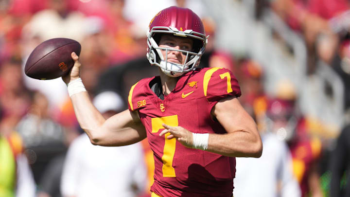 Sep 28, 2024; Los Angeles, California, USA; Southern California Trojans quarterback Miller Moss (7) throws the ball against the Wisconsin Badgers in the first half at United Airlines Field at Los Angeles Memorial Coliseum. Mandatory Credit: Kirby Lee-Imagn Images Sep 28, 2024; Los Angeles, California, USA; Southern California Trojans quarterback Miller Moss (7) throws the ball against the Wisconsin Badgers in the first half at United Airlines Field at Los Angeles Memorial Coliseum. Mandatory Credit: Kirby Lee-Imagn Images