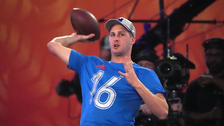 Jan 30, 2025; Orlando, FL, USA; NFC quarterback Jared Goff (16) throws the ball during the Passing the Test event at the Pro Bowl Skills Challenge at Nicholson Fieldhouse. Mandatory Credit: Kirby Lee-Imagn Images