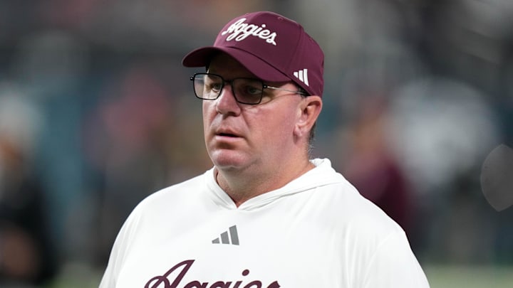Dec 27, 2024; Las Vegas, NV, USA; Texas A&M Aggies head coach Mike Elko reacts against the Southern California Trojans in the first half at Allegiant Stadium. Mandatory Credit: Kirby Lee-Imagn Images