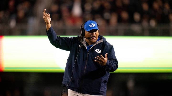 BYU Cougars head coach Kalani Sitake coaches in the fourth quarter of the NCAA football game between the Cincinnati Bearcats and BYU Cougars at Nippert Stadium in Cincinnati on Nov. 22, 2025.