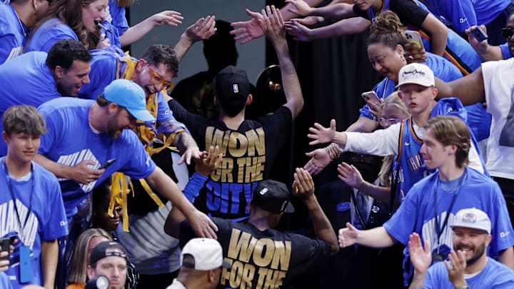 Jun 22, 2025; Oklahoma City, Oklahoma, USA; The Oklahoma City Thunder players greet fans as they walk off the court after winning game seven of the 2025 NBA Finals against the Indiana Pacers at Paycom Center.