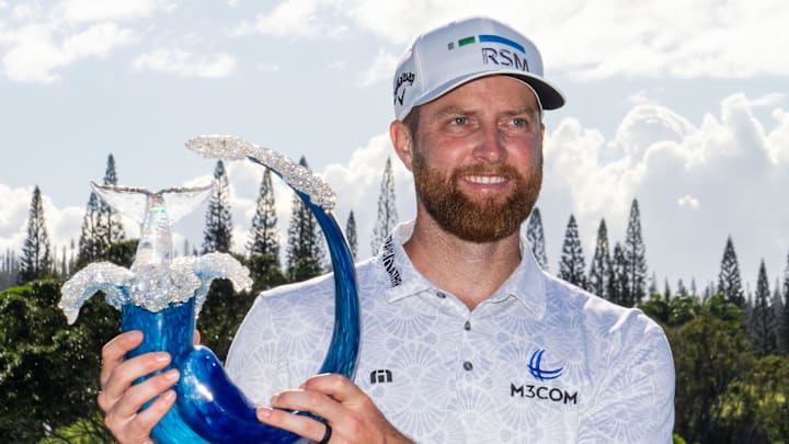 Chris Kirk celebrates with the trophy after winning the 2024 Sentry. 
