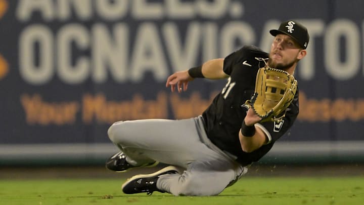 Anaheim, California, USA; Chicago White Sox right fielder Zach DeLoach (31) makes a sliding catch off a ball hit by Los Angeles Angels second baseman Charles Leblanc (33) for the final out of the ninth inning at Angel Stadium.