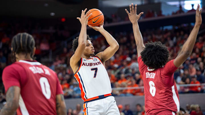 Auburn Tigers forward Keyshawn Hall (7) takes a jump shot over Alabama Crimson Tide forward London Jemison (6) as Auburn Tigers take on Alabama Crimson Tide at Neville Arena in Auburn, Ala. on Saturday, Feb. 7, 2026. Alabama Crimson Tide defeated Auburn Tigers 96-92. Auburn Tigers forward Keyshawn Hall (7) takes a jump shot over Alabama Crimson Tide forward London Jemison (6) as Auburn Tigers take on Alabama Crimson Tide at Neville Arena in Auburn, Ala. on Saturday, Feb. 7, 2026. Alabama Crimson Tide defeated Auburn Tigers 96-92.