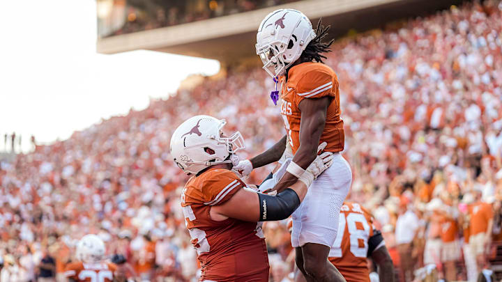 Texas Longhorns center Jake Majors (65) celebrates a touchdown my receiver Isaiah Bond (7) during the game against Mississippi State at Darrell K Royal-Texas Memorial Stadium in Austin Saturday, Sept. 28, 2024.