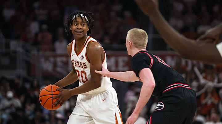Texas Longhorns guard Tre johnson (20) is guarded by Georgia guard Blue Cain (0) during the game at the Moody Center on Saturday, March 1, 2025.