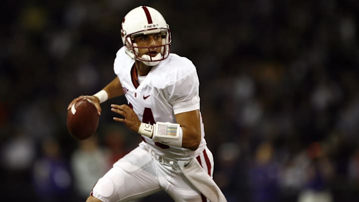 Sept 27, 2008; Seattle, WA, USA; Stanford Cardinal quarterback Tavita Pritchard (14) scrambles out of the pocket against the Washington Huskies during the first half at Husky Stadium. Stanford defeated Washington, 35-28. Mandatory Credit: Joe Nicholson-Imagn Images