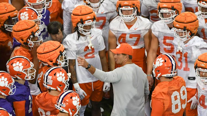 Clemson head coach Dabo Swinney talks with players during the first football practice at the Allen N. Reeves Football Complex at Clemson University in Clemson, S.C. Friday, February 28, 2025.