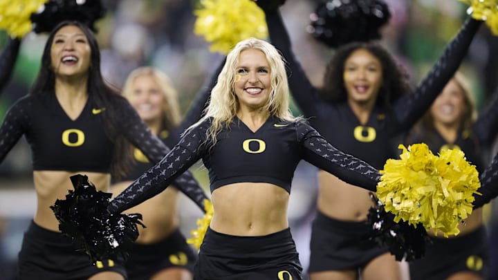 Nov 30, 2024; Eugene, Oregon, USA; The Oregon Ducks cheer team perform during a time out during the second half of a game against the Washington Huskies at Autzen Stadium. Mandatory Credit: Troy Wayrynen-Imagn Images Nov 30, 2024; Eugene, Oregon, USA; The Oregon Ducks cheer team perform during a time out during the second half of a game against the Washington Huskies at Autzen Stadium. Mandatory Credit: Troy Wayrynen-Imagn Images