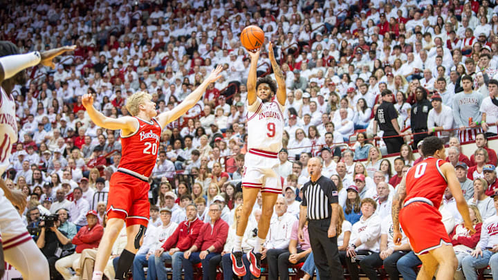 Indiana's Kanaan Carlyle (9) shoots past Ohio State's Colin White (20) during the Indiana versus Ohio State men's basketball game at Simon Skjodt Assembly Hall on Saturday, March 8, 2025.