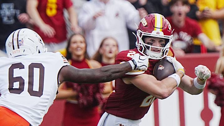 Iowa State running back Aiden Flora (21) breaks a tackle by a Bowling Green defender during the second quarter on Sept. 19, 2026, at Jack Trice Stadium in Ames, Iowa. Iowa State running back Aiden Flora (21) breaks a tackle by a Bowling Green defender during the second quarter on Sept. 19, 2026, at Jack Trice Stadium in Ames, Iowa.