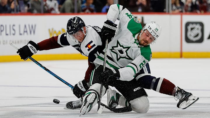 Oct 11, 2025; Denver, Colorado, USA; Dallas Stars center Roope Hintz (24) wins the face against Colorado Avalanche center Brock Nelson (11) off in overtime at Ball Arena. Mandatory Credit: Isaiah J. Downing-Imagn Images