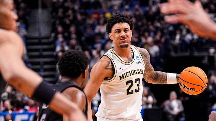 Michigan forward Yaxel Lendeborg (23) looks to pass the ball against Howard during the second half of NCAA Tournament First Round at KeyBank Center in Buffalo on Thursday, March 19, 2026.