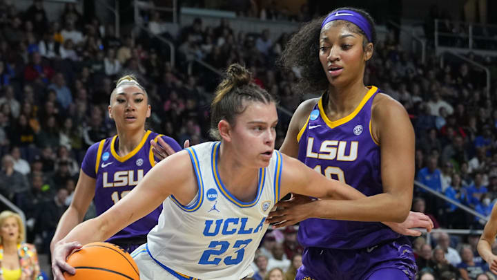 Mar 30, 2024; Albany, NY, USA; UCLA Bruins forward Gabriela Jaquez (23) dribbles the ball against LSU Tigers forward Angel Reese (10) during the first half in the semifinals of the Albany Regional of the 2024 NCAA Tournament at MVP Arena. Mandatory Credit: Gregory Fisher-Imagn Images