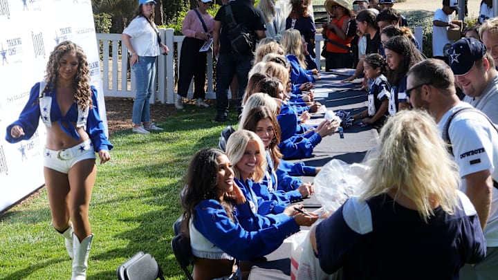Dallas Cowboys cheerleaders greet fans and sign autographs in Oxnard to celebrate the team's return to training camp. 