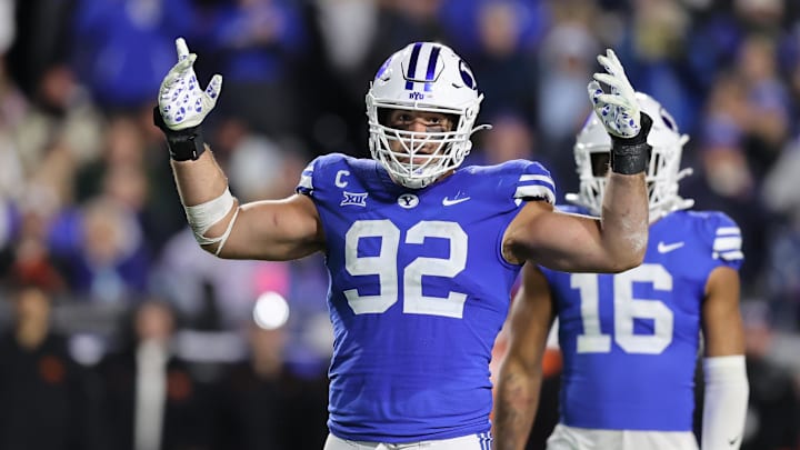 Oct 18, 2024; Provo, Utah, USA; Brigham Young Cougars defensive end Tyler Batty (92) encourages fans to cheer against the Oklahoma State Cowboys during the fourth quarter at LaVell Edwards Stadium. Oct 18, 2024; Provo, Utah, USA; Brigham Young Cougars defensive end Tyler Batty (92) encourages fans to cheer against the Oklahoma State Cowboys during the fourth quarter at LaVell Edwards Stadium.