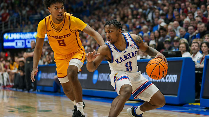 Feb 3, 2025; Lawrence, Kansas, USA; Kansas Jayhawks guard David Coit (8) dribbles the ball against Iowa State Cyclones guard Curtis Jones (5) during the second half at Allen Fieldhouse. Mandatory Credit: Jay Biggerstaff-Imagn Images