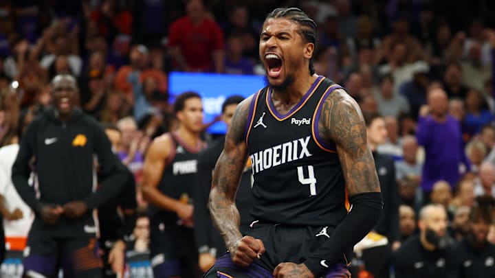 Apr 17, 2026; Phoenix, Arizona, USA; Phoenix Suns guard Jalen Green (4) celebrates after a slam dunk against the Golden State Warriors during the first half in the play-in rounds of the 2026 NBA Playoffs at Mortgage Matchup Center. Mandatory Credit: Mark J. Rebilas-Imagn Images