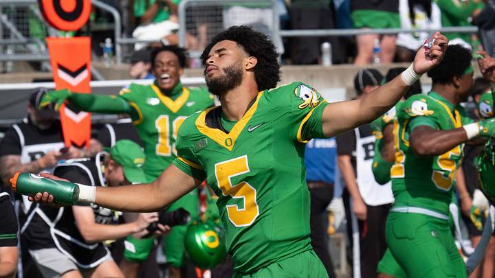 Oregon quarterback Dante Moore dances to the song “Shout” during a timeout at Autzen.