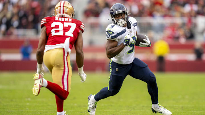 November 17, 2024; Santa Clara, California, USA; Seattle Seahawks running back Kenneth Walker III (9) runs the football against Seattle Seahawks cornerback Riq Woolen (27) during the third quarter at Levi's Stadium.