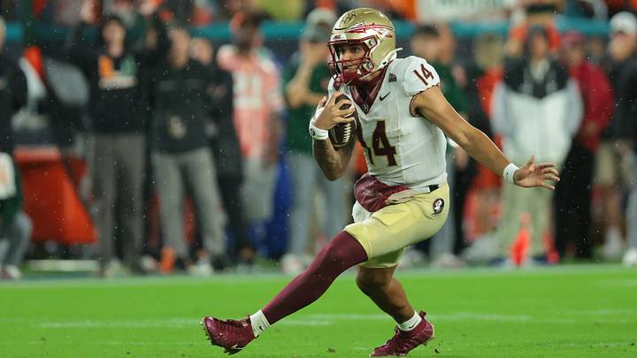 Oct 17, 2026; Miami Gardens, Florida, USA;  Florida State Seminoles quarterback Ashton Daniels (14) runs during the first quarter against the Miami Hurricanes at Hard Rock Stadium.  Mandatory Credit: Sam Navarro-Imagn Images