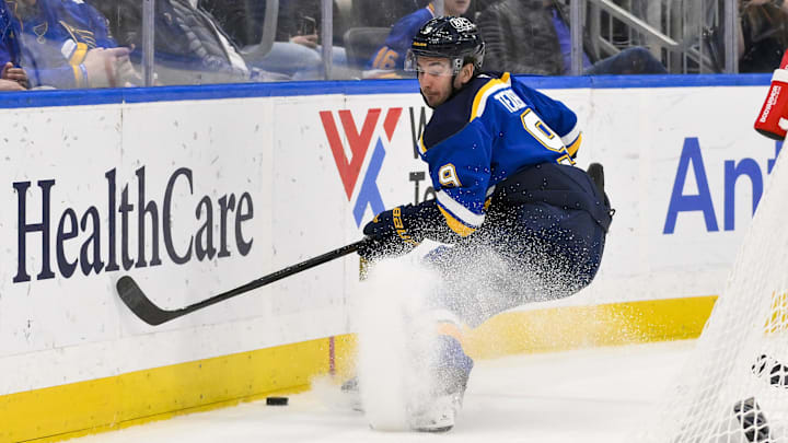 Mar 23, 2025; St. Louis, Missouri, USA;  St. Louis Blues center Alexandre Texier (9) controls the puck against the Nashville Predators during the second period at Enterprise Center. Mandatory Credit: Jeff Curry-Imagn Images