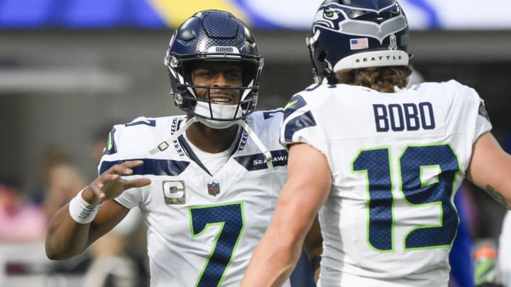 Nov 19, 2023; Inglewood, California, USA; Seattle Seahawks quarterback Geno Smith (7) and wide receiver Jake Bobo (19)  during pregame warmup before an NFL game against the Los Angeles Rams at SoFi Stadium.