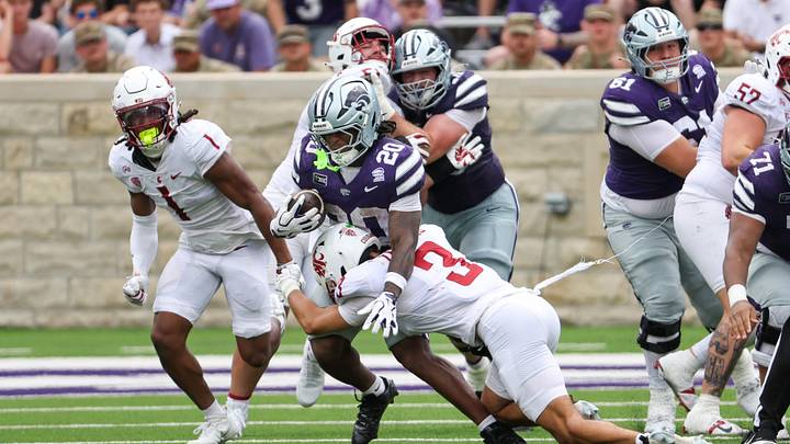 Kansas State Wildcats running back Rodney Fields Jr. (20) is tackled by Washington State Cougars defensive back Jaylen Thomas (3) during the second quarter at Bill Snyder Family Football Stadium. Kansas State Wildcats running back Rodney Fields Jr. (20) is tackled by Washington State Cougars defensive back Jaylen Thomas (3) during the second quarter at Bill Snyder Family Football Stadium.