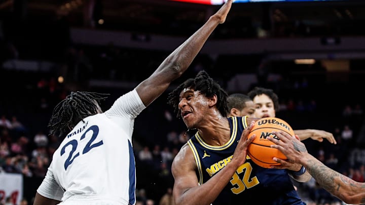 Michigan forward Tarris Reed Jr. (32) goes to the basket against Penn State forward Qudus Wahab (22)