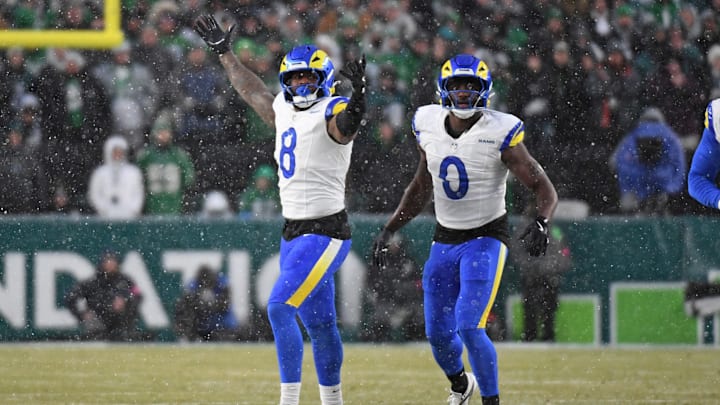 Jan 19, 2025; Philadelphia, Pennsylvania, USA; Los Angeles Rams linebacker Jared Verse (8) and linebacker Byron Young (0) celebrate a sack against the Philadelphia Eagles in a 2025 NFC divisional round game at Lincoln Financial Field. Mandatory Credit: Eric Hartline-Imagn Images
