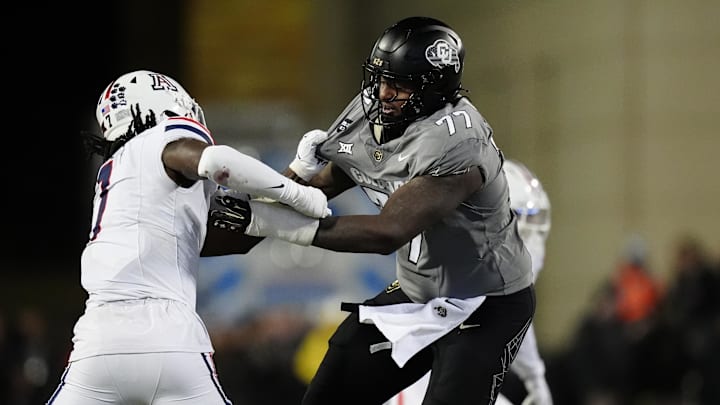 Nov 1, 2025; Boulder, Colorado, USA; Colorado Buffaloes offensive lineman Jordan Seaton (77) and Arizona Wildcats linebacker Chase Kennedy (7) during the second half at Folsom Field. Mandatory Credit: Ron Chenoy-Imagn Images