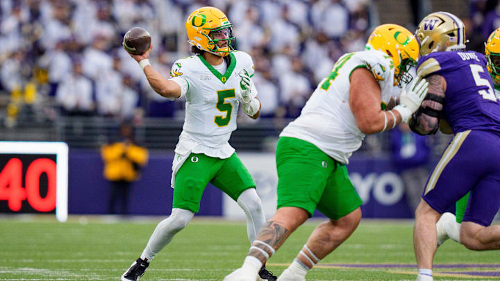 Oregon quarterback Dante Moore throws a pass as the Oregon Ducks take on the Washington Huskies