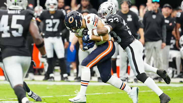 Cole Kmet hauls in a pass from Caleb Williams and heads upfield against the Raiders. Cole Kmet hauls in a pass from Caleb Williams and heads upfield against the Raiders.