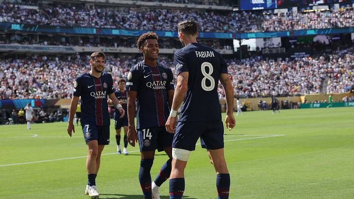 [Subscription Customers Only] Jul 9, 2025; East Rutherford, New Jersey, USA; Paris Saint-Germain midfielder Fabian Ruiz (8)  celebrates scoring their third goal with forward Desire Doue (14) and forward Khvicha Kvaratskhelia (7) during a semifinal match of the 2025 FIFA Club World Cup at MetLife Stadium. Mandatory Credit: Amanda Perobelli-Reuters via Imagn Images