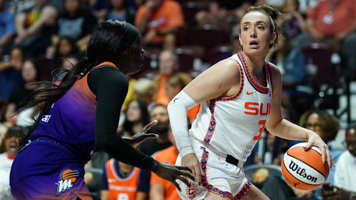 Connecticut Sun guard Marina Mabrey (3) looks for an opening against Phoenix Mercury guard Kahleah Copper (2) in the first half at Mohegan Sun Arena. 