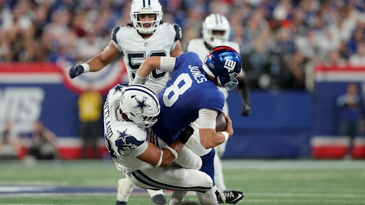 Dallas Cowboys defensive end Marshawn Kneeland sacks New York Giants quarterback Daniel Jones.