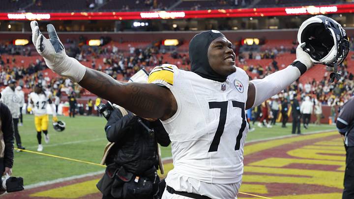 Nov 10, 2024; Landover, Maryland, USA; Pittsburgh Steelers offensive tackle Broderick Jones (77) celebrates while leaving the field after the Steelers' game against the Washington Commanders at Northwest Stadium. Mandatory Credit: Geoff Burke-Imagn Images