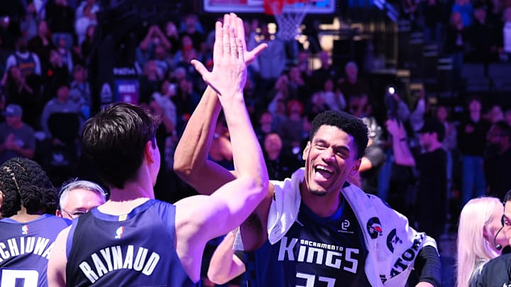 Dec 27, 2025; Sacramento, California, USA; Sacramento Kings center Maxime Raynaud (42) and center Dylan Cardwell (32) celebrate after the game against the Dallas Mavericks at Golden 1 Center. Mandatory Credit: Kelley L Cox-Imagn Images