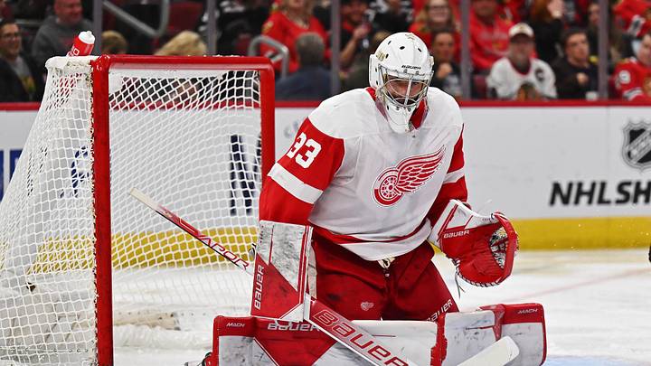 Oct 1, 2022; Chicago, Illinois, USA;  Detroit Red Wings goaltender Sebastian Cossa (33) defends the net against the Chicago Blackhawks at United Center. Mandatory Credit: Jamie Sabau-Imagn Images
