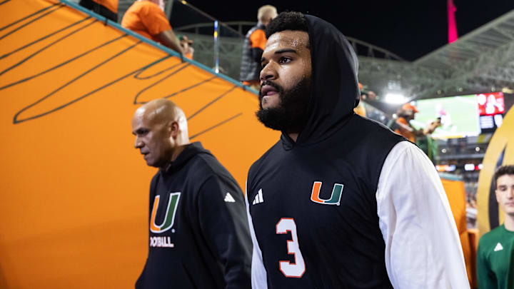 Jan 19, 2026; Miami Gardens, FL, USA; Miami Hurricanes defensive lineman Akheem Mesidor (3) with coach Jason Taylor against the Indiana Hoosiers during the College Football Playoff National Championship game at Hard Rock Stadium. Mandatory Credit: Mark J. Rebilas-Imagn Images Jan 19, 2026; Miami Gardens, FL, USA; Miami Hurricanes defensive lineman Akheem Mesidor (3) with coach Jason Taylor against the Indiana Hoosiers during the College Football Playoff National Championship game at Hard Rock Stadium. Mandatory Credit: Mark J. Rebilas-Imagn Images
