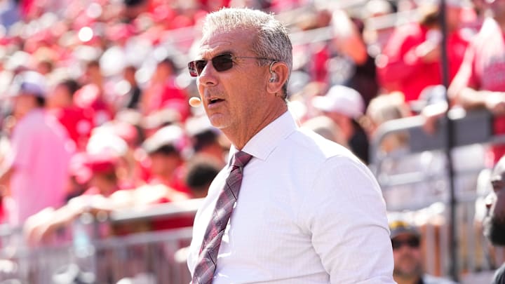 Former Ohio State Buckeyes head coach Urban Meyer, now with Fox Sports, watches on the sideline during the NCAA football game against the Texas Longhorns at Ohio Stadium on Aug. 30, 2025.