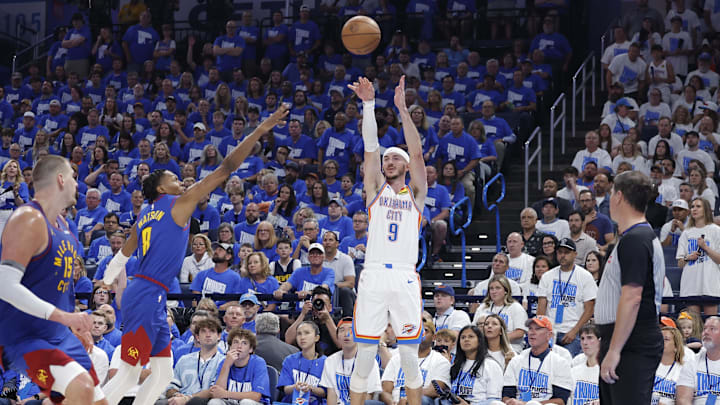 May 13, 2025; Oklahoma City, Oklahoma, USA; Oklahoma City Thunder guard Alex Caruso (9) shoots a three point basket against the Denver Nuggets during the second half of game five of the second round for the 2025 NBA Playoffs at Paycom Center. Mandatory Credit: Alonzo Adams-Imagn Images