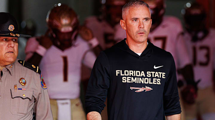 Nov 29, 2025; Gainesville, Florida, USA; Florida State Seminoles head coach Mike Norvell walks out of the tunnel before a game against the Florida Gators at Ben Hill Griffin Stadium. Mandatory Credit: Matt Pendleton-Imagn Images