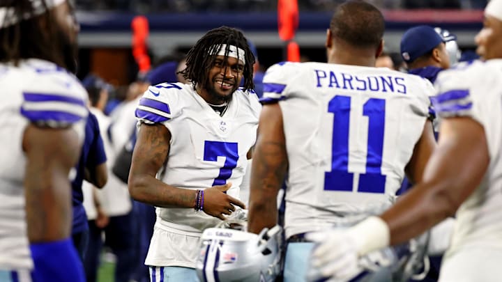 Dallas Cowboys cornerback Trevon Diggs smiles while talking with linebacker Micah Parsons on the sideline during the fourth quarter of their game against the Philadelphia Eagles..