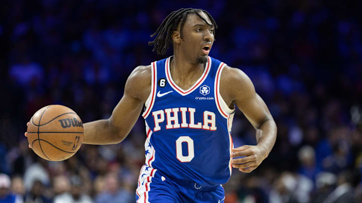 Feb 23, 2023; Philadelphia, Pennsylvania, USA; Philadelphia 76ers guard Tyrese Maxey (0) dribbles the ball against the Memphis Grizzlies during the fourth quarter at Wells Fargo Center. Mandatory Credit: Bill Streicher-Imagn Images